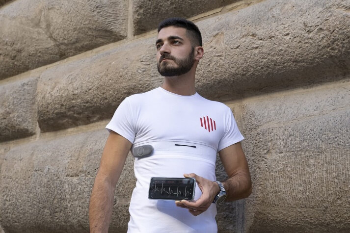 A person holding a phoneDescription automatically generated with low confidence